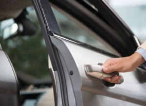 Car lockout service in Boynton Beach FL with professional locksmith duplicating a car key