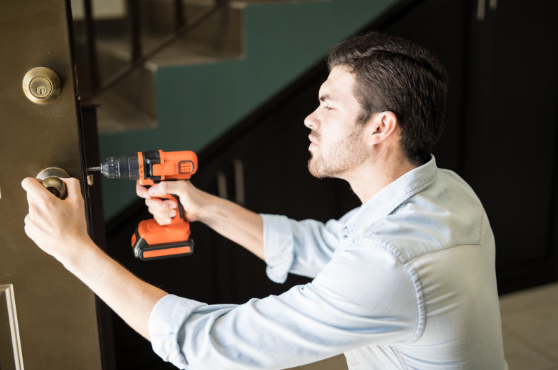 Commercial locksmith in West Palm Beach FL installing high-security locks for a local business